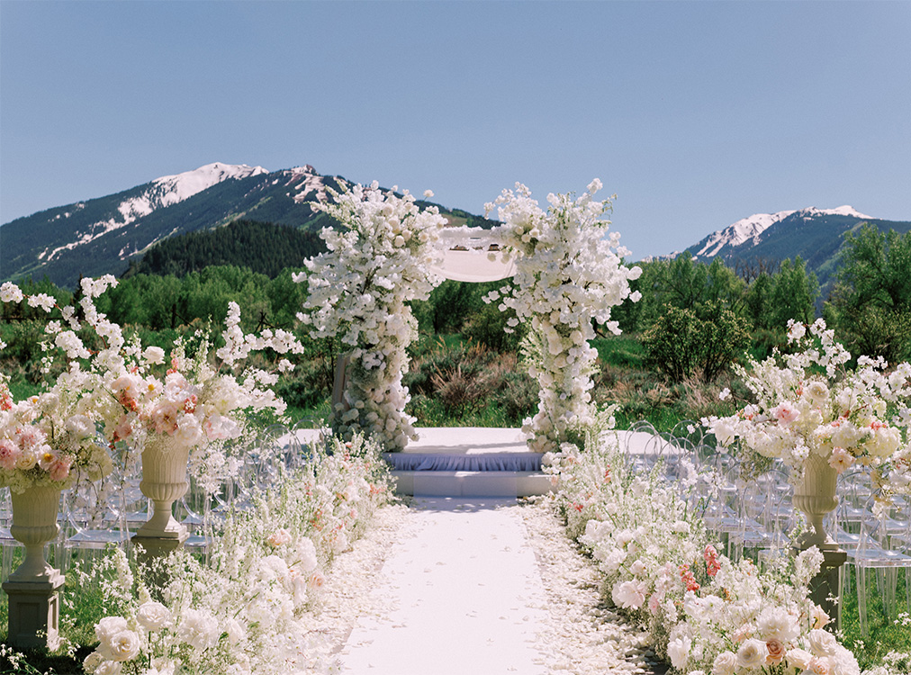 wedding ceremony with lots of white flowers